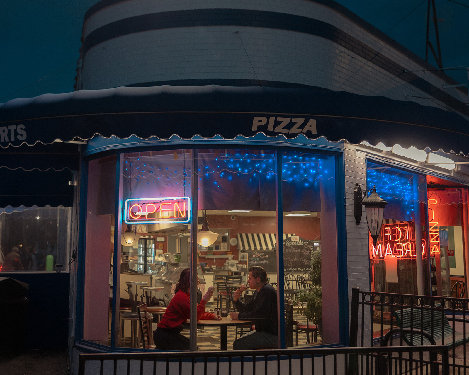 Couple eating ice cream together at a Michigan Ice Cream Shop