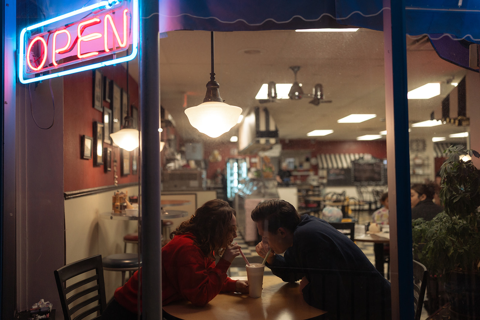 Cinematic engagement photos at a Michigan ice cream shop