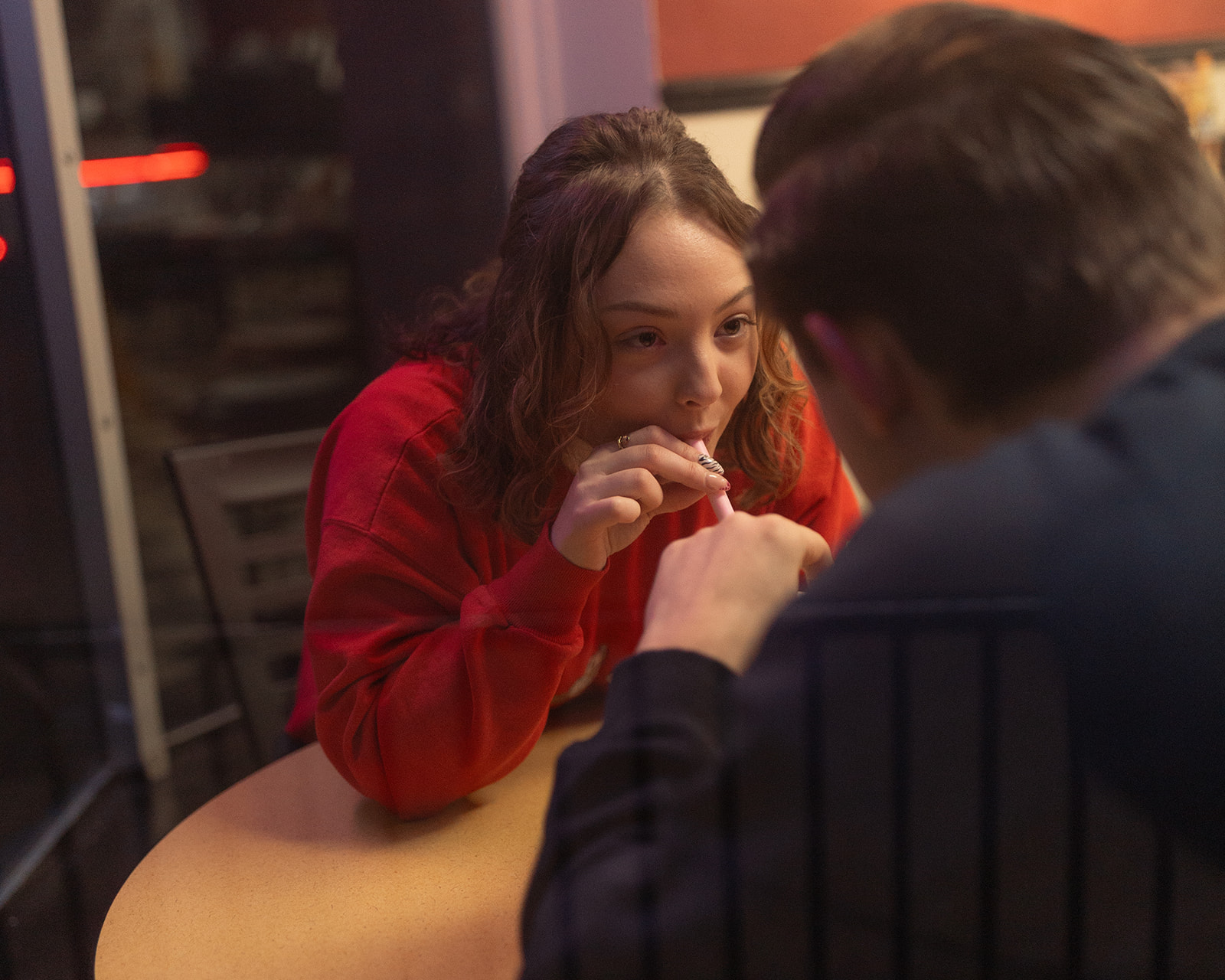 Couple drinking a milkshake together