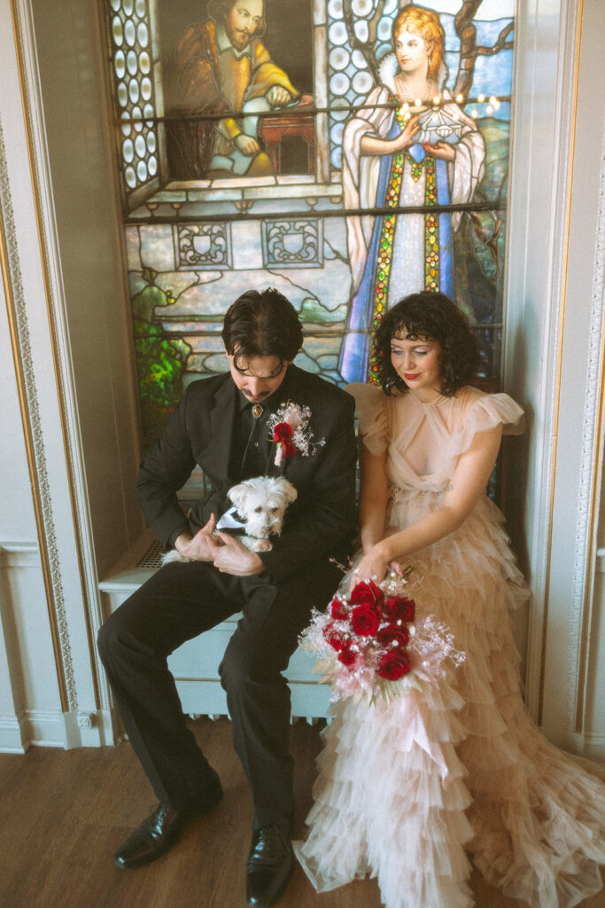 Couple posing with their dog during their non-traditional Grand Rapids, Michigan elopement