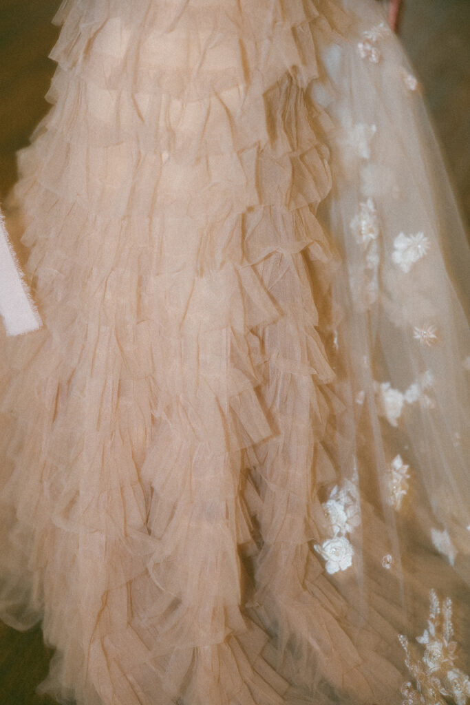 Blush pink ruffled elopement dress detail shot
