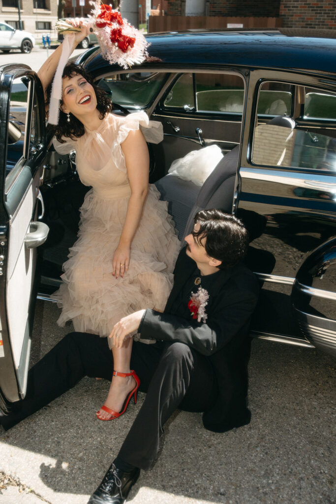 Bride laughing with bouquet in hand during downtown Michigan elopement shoot