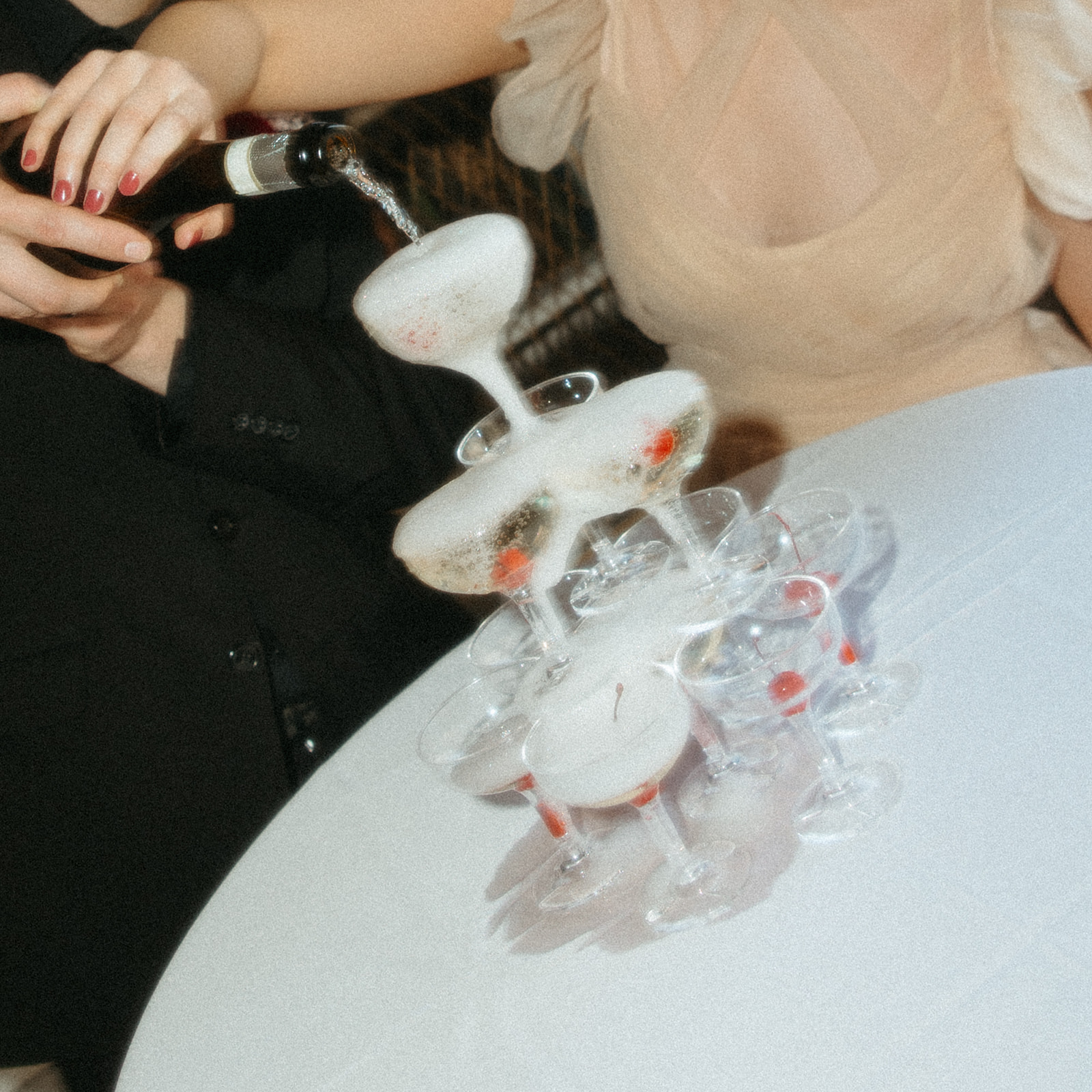 Bride and grooms elopement champagne tower