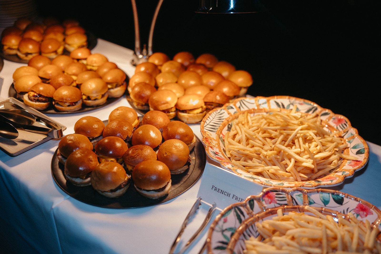 Late night wedding reception snacks of burger sliders and fries