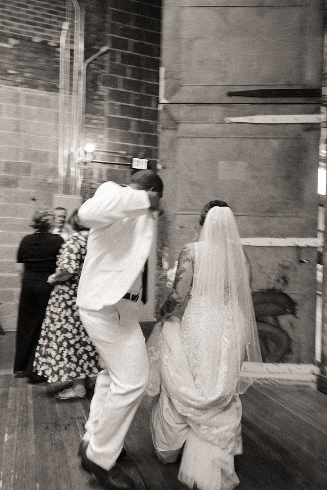 Bride and groom dancing during their Michigan wedding reception in Detroit at The Jam Handy