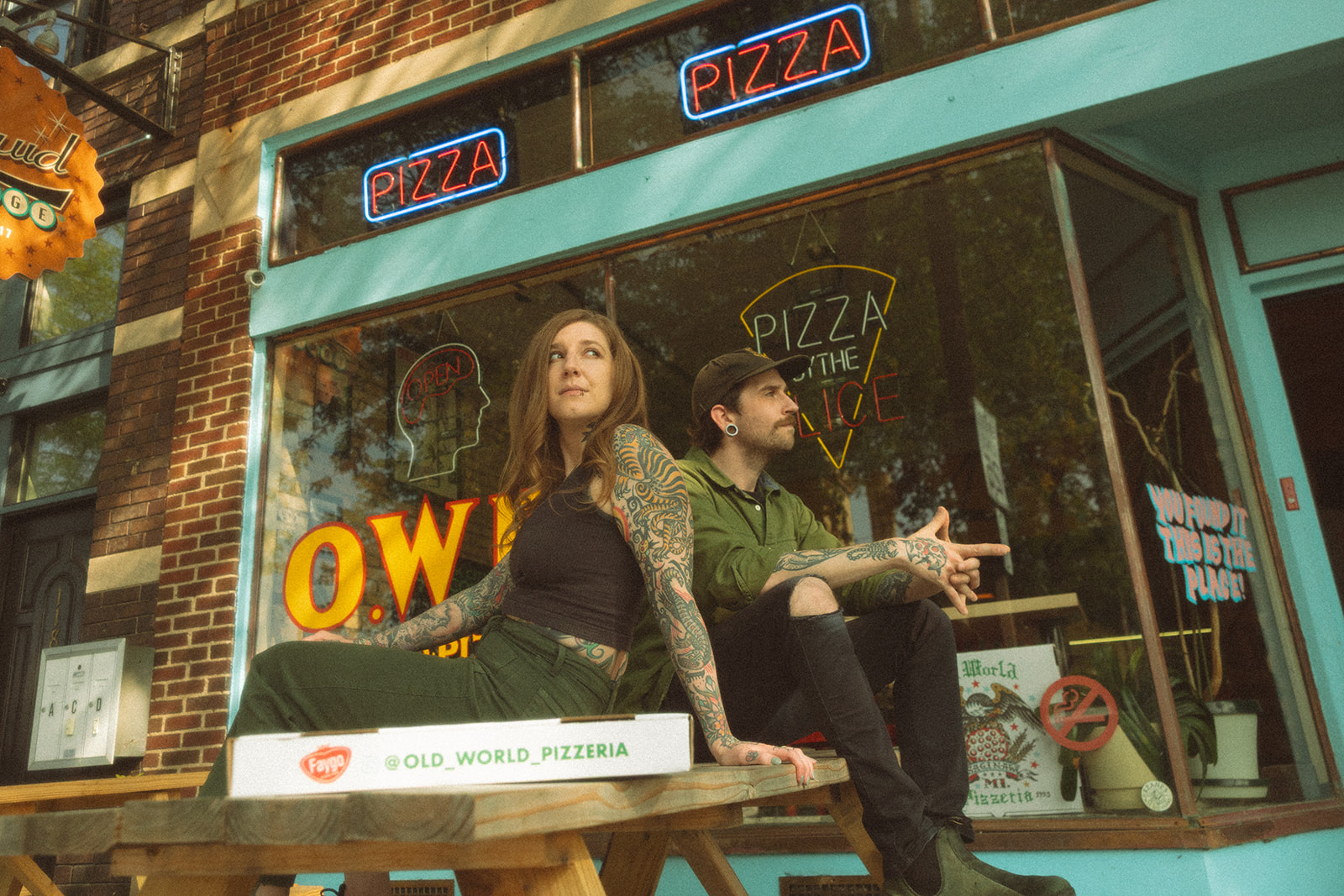 Couples casual, low-key engagement photos at Old World Pizzeria in Michigan