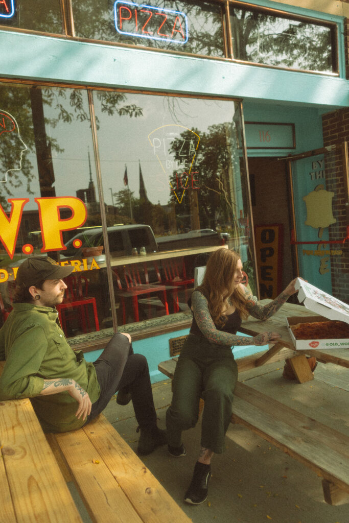 Man and woman getting slices of pizza in Saginaw, Michigan