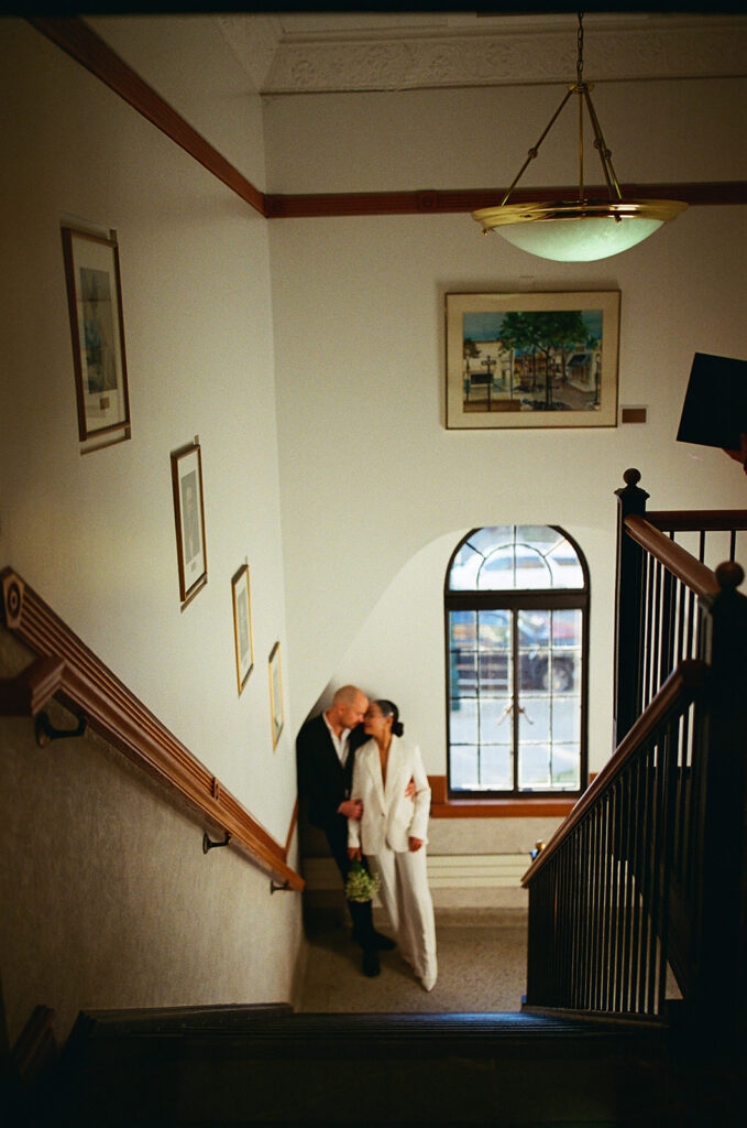 Couple captured on film as they pose at Birmingham City Hall for their elopement photos.