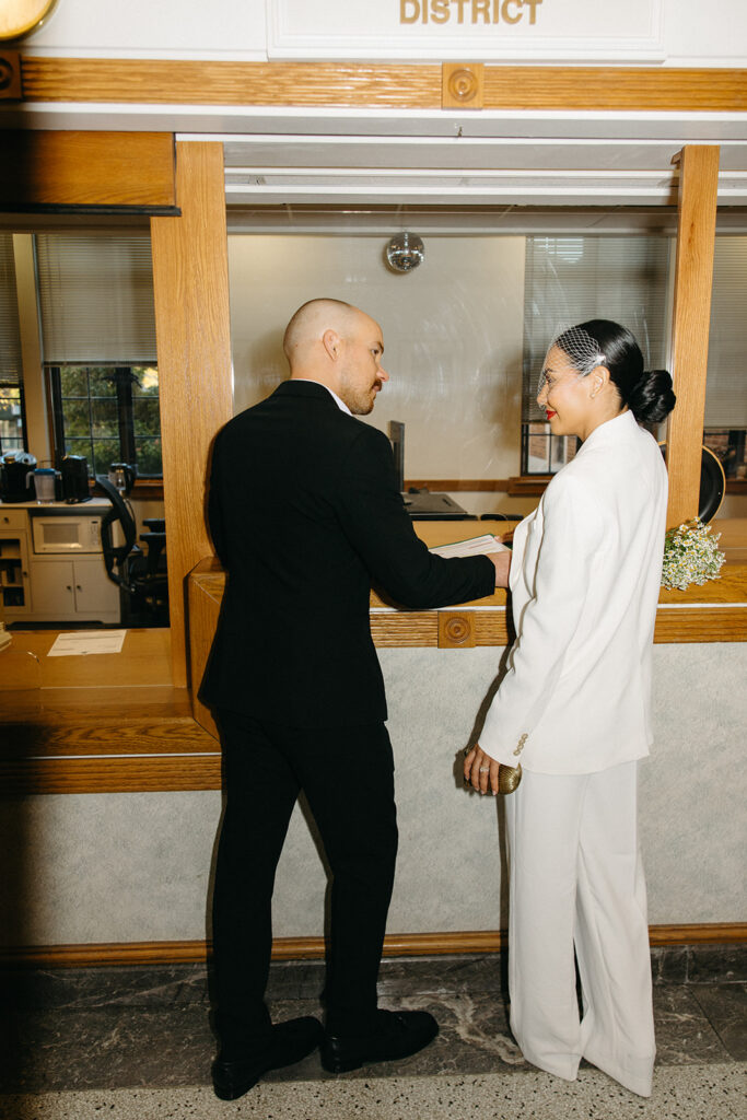 Couple turning in their marriage certificate after their elopement. 