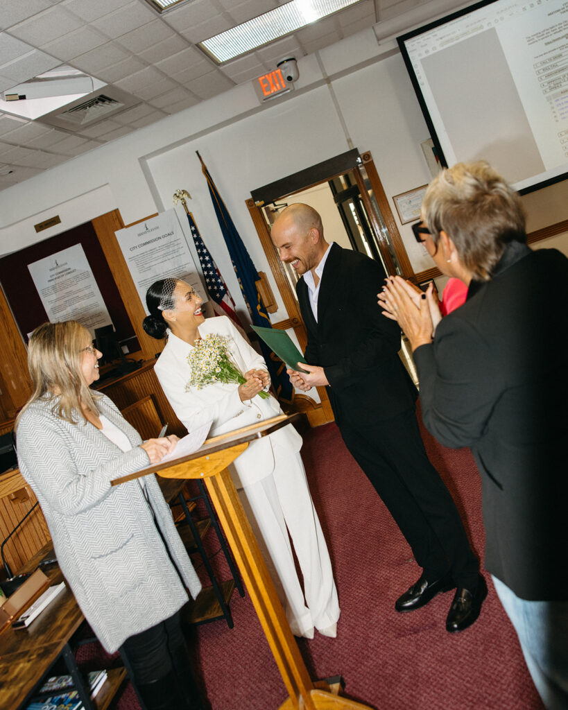 Couple smiling during their Birmingham City Hall elopement. 