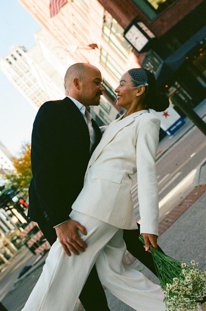 Bride and groom posing in downtown Detroit captured on film.