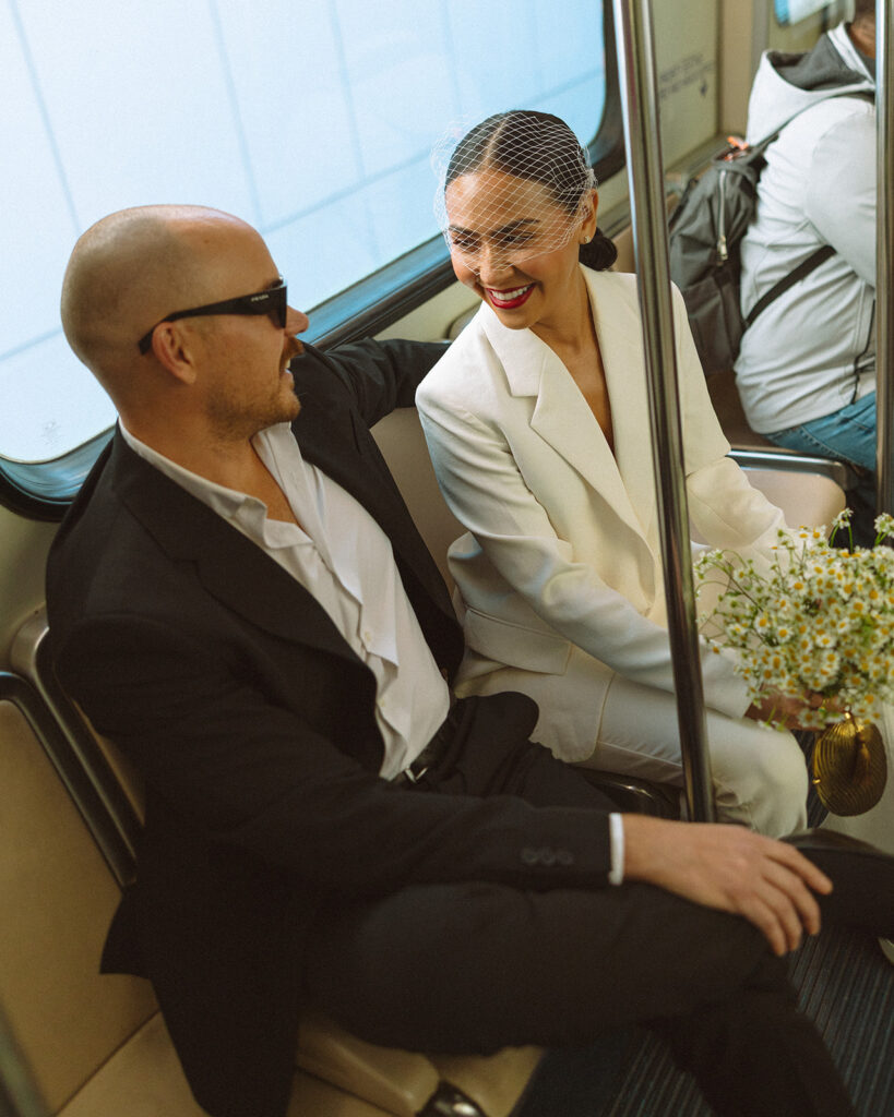 Couple sitting on the People Mover together in Detroit. 
