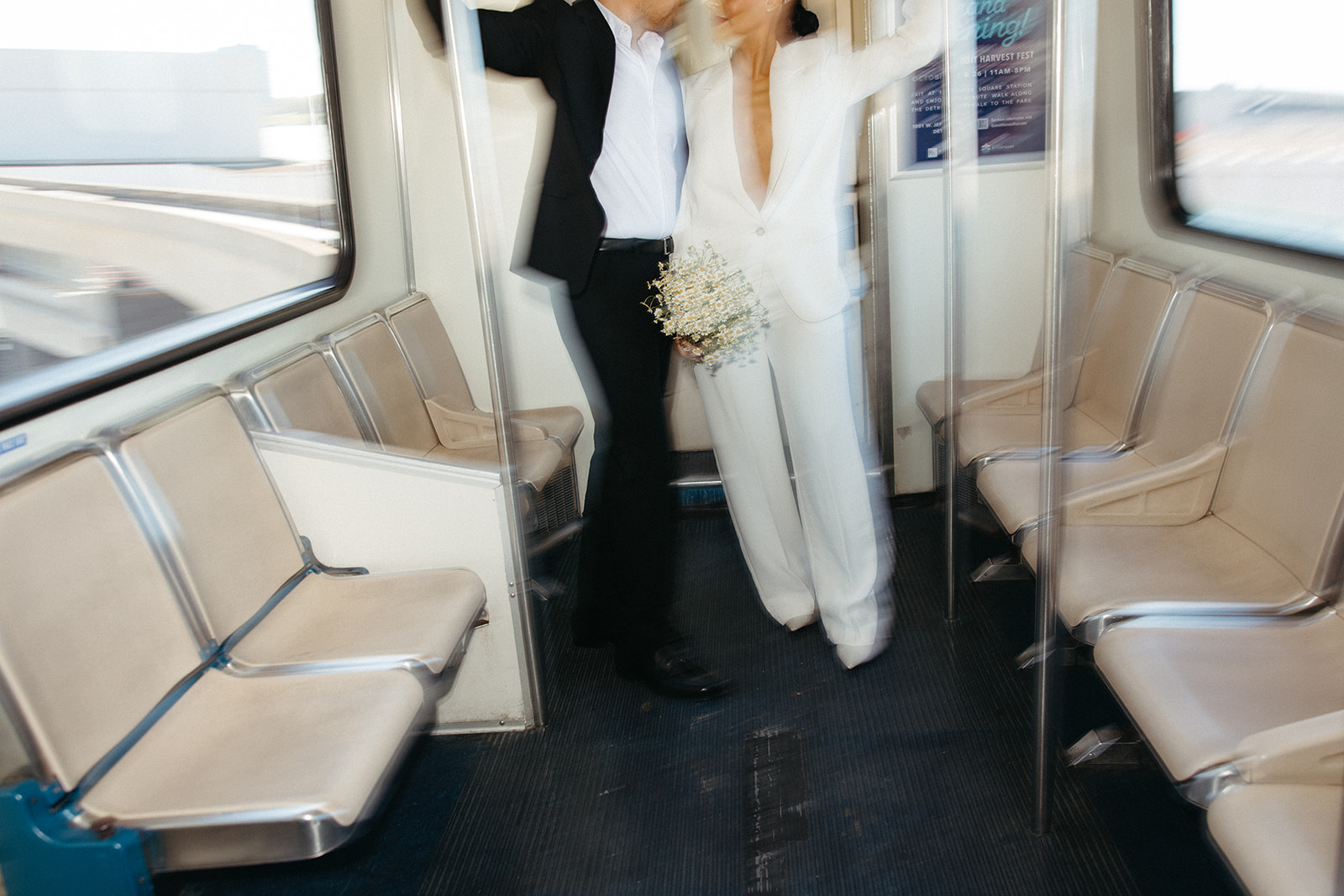 Motion blur images of a couple standing together on the People Mover in Detroit, Michigan. 