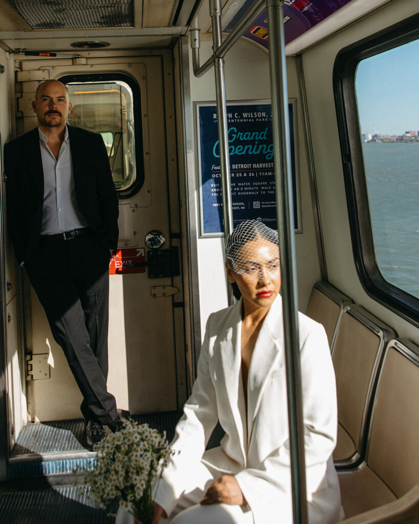 Couples editorial Detroit elopement photos on the People Mover.