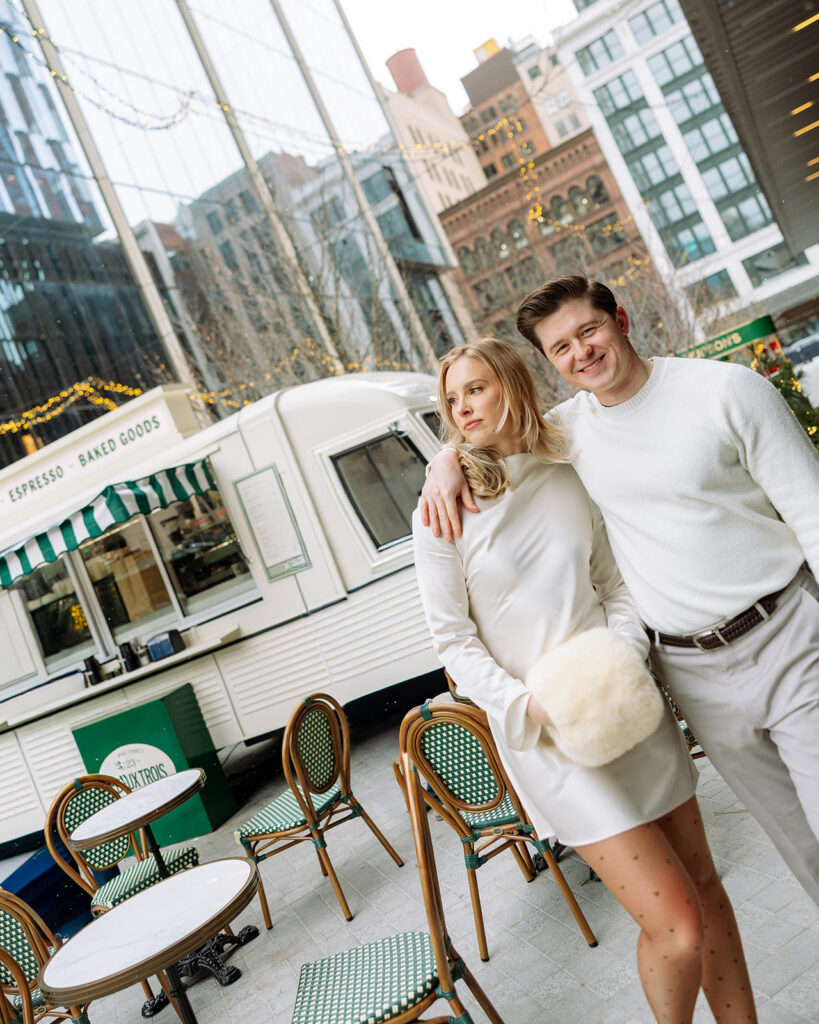 Couple standing near the Un Deux Trois café truck in downtown Detroit.