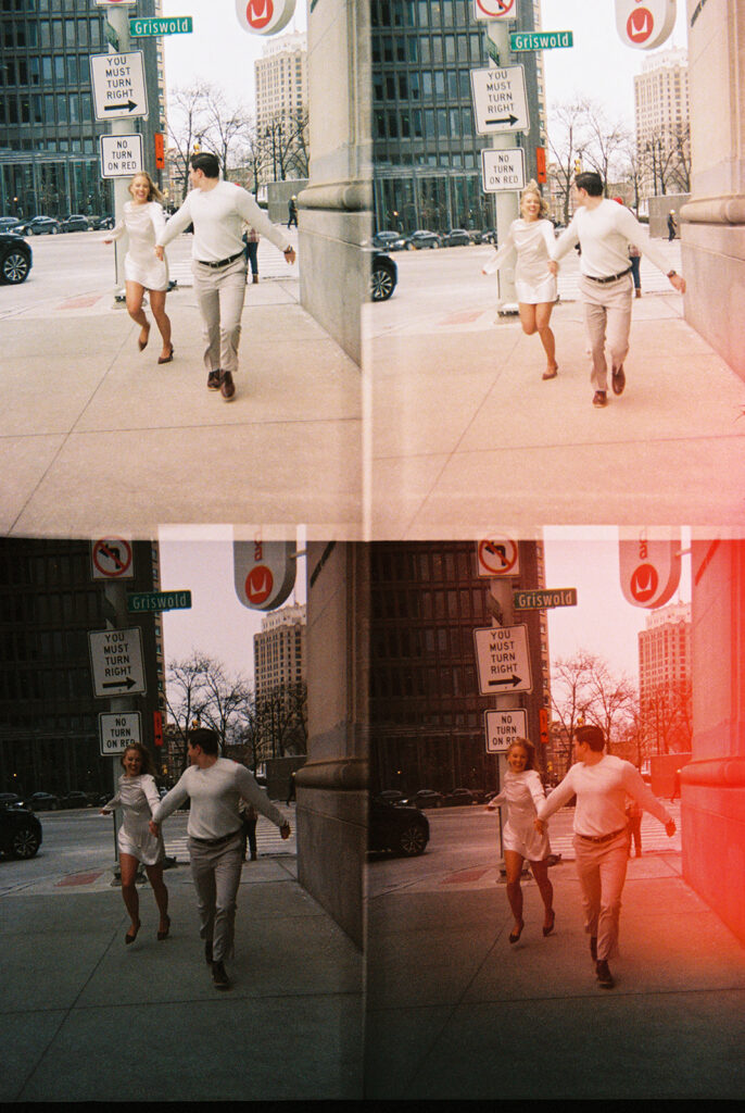 Film scan of couple running together in downtown Detroit with light leaks and motion blur.