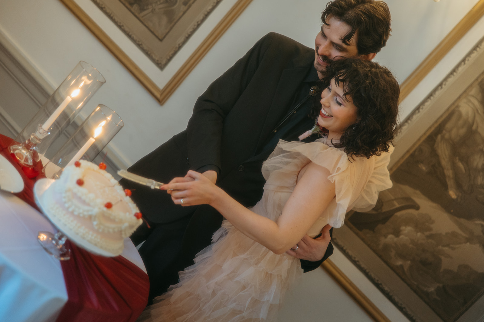 Couple cutting into their wedding cake after their Grand Rapids, Michigan elopement. 