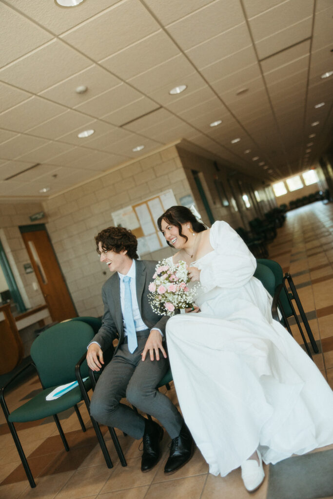 Couple waiting in the lobby for their Michigan courthouse wedding.