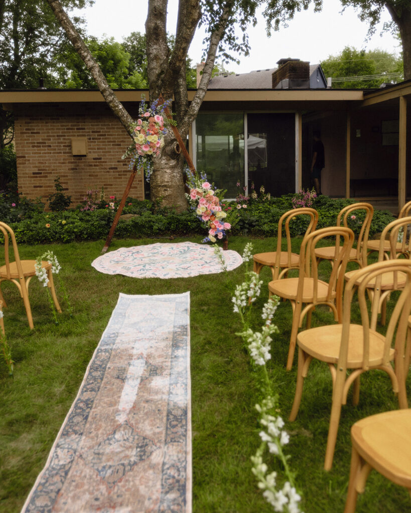 An intimate Michigan micro wedding ceremony set up in the backyard.