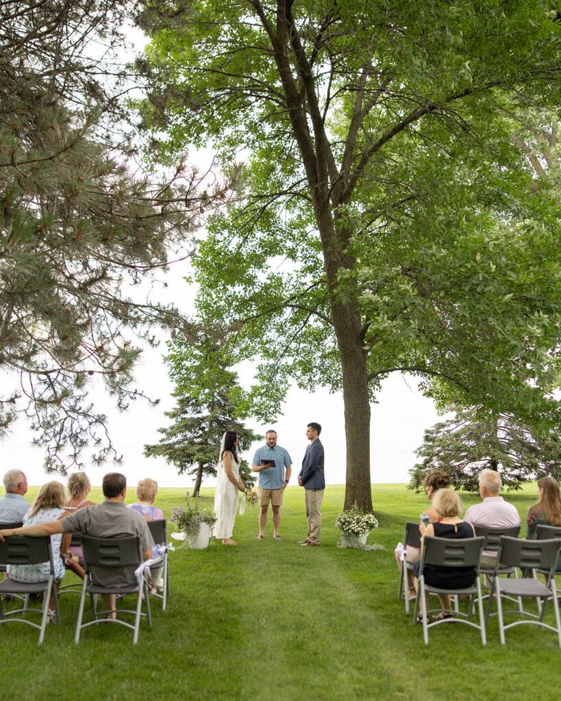 An intimate Michigan micro wedding ceremony along the shore.