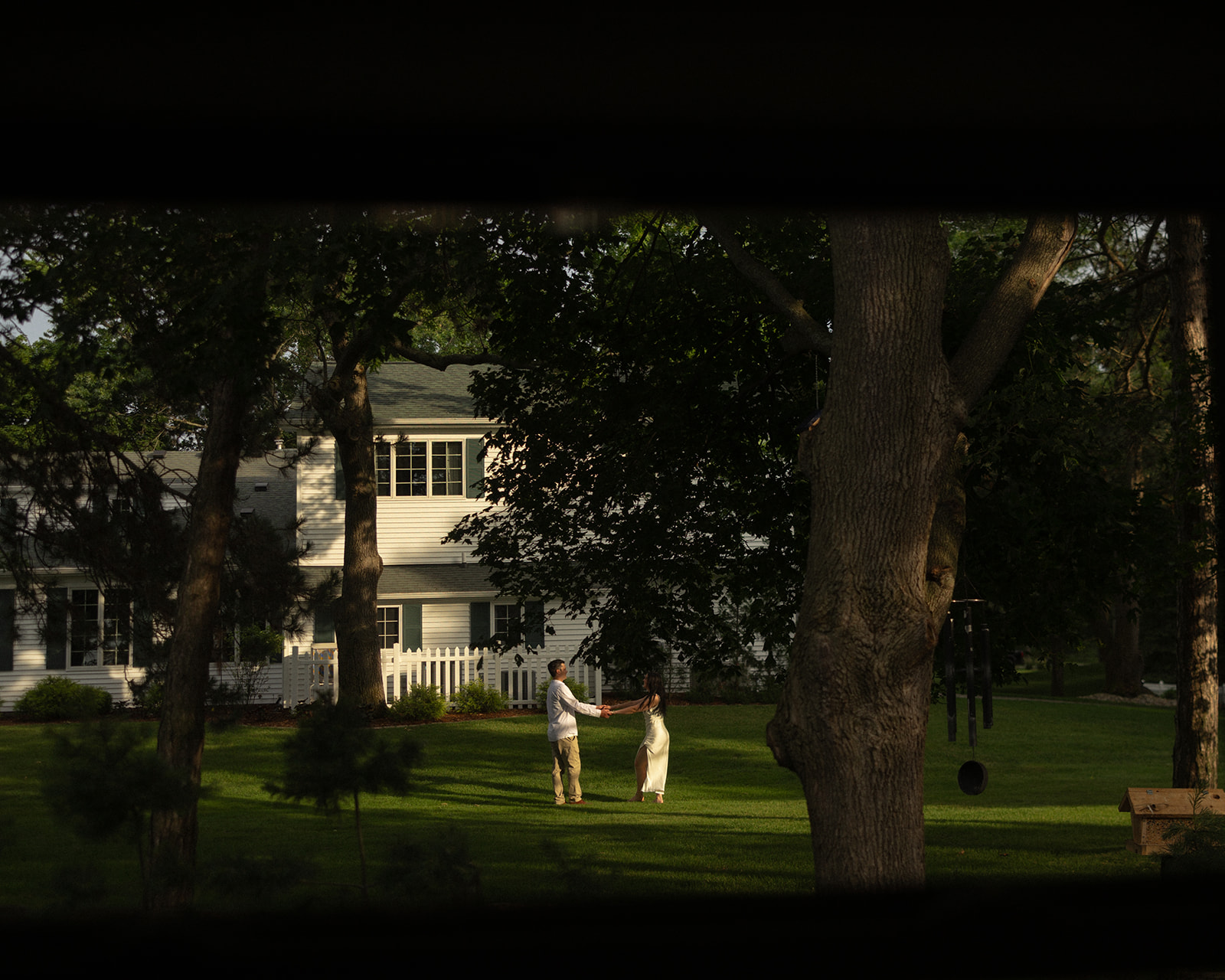 Couple posing on the lawn during their Airbnb Michigan micro wedding.