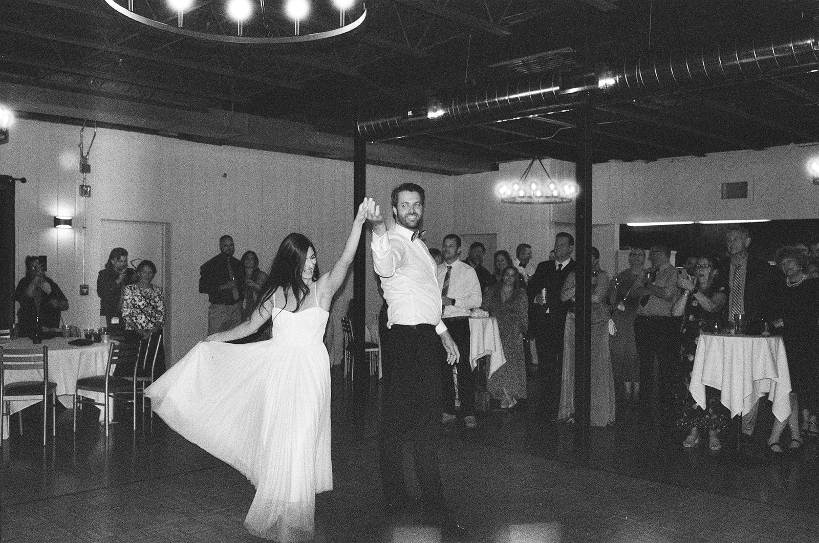 35mm film photo of a couple sharing their first dance during their Michigan documentary wedding.