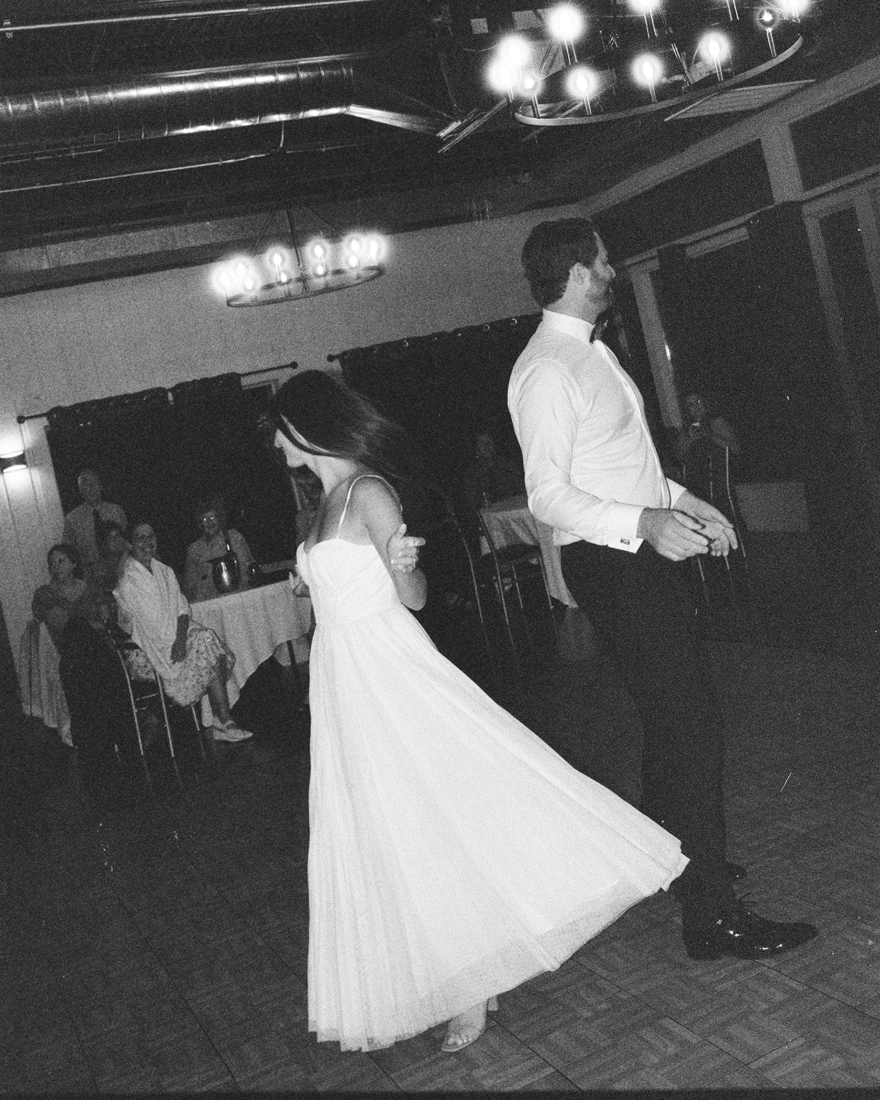 35mm film photo of a couple sharing their first dance during their Michigan documentary wedding.