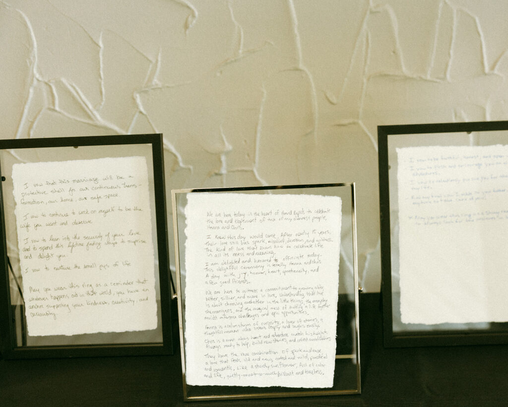 Hand written notes framed as wedding decor for a wedding reception party.