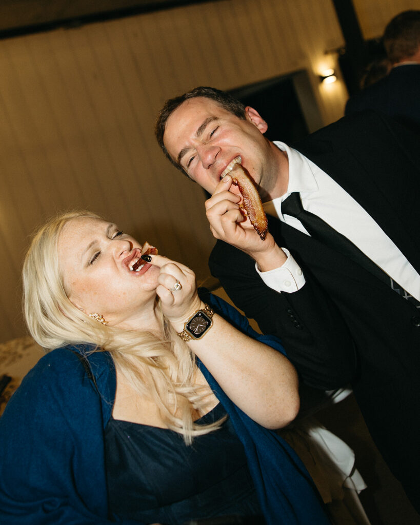 Guests enjoying bacon during a Michigan wedding reception.