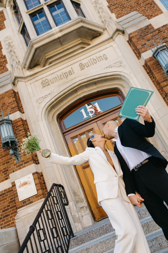 Couple walking out of the courthouse after their Detroit Michigan elopement.