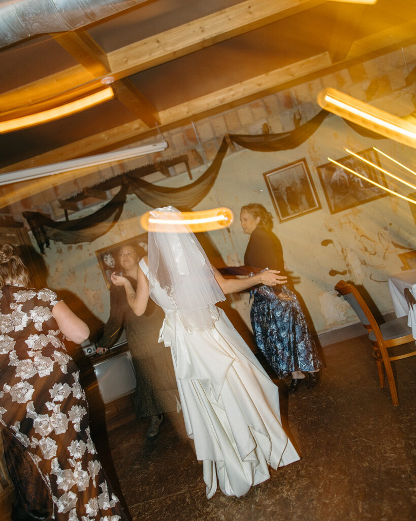 Bride dancing with guests during her Clarkston, Michigan wedding reception.