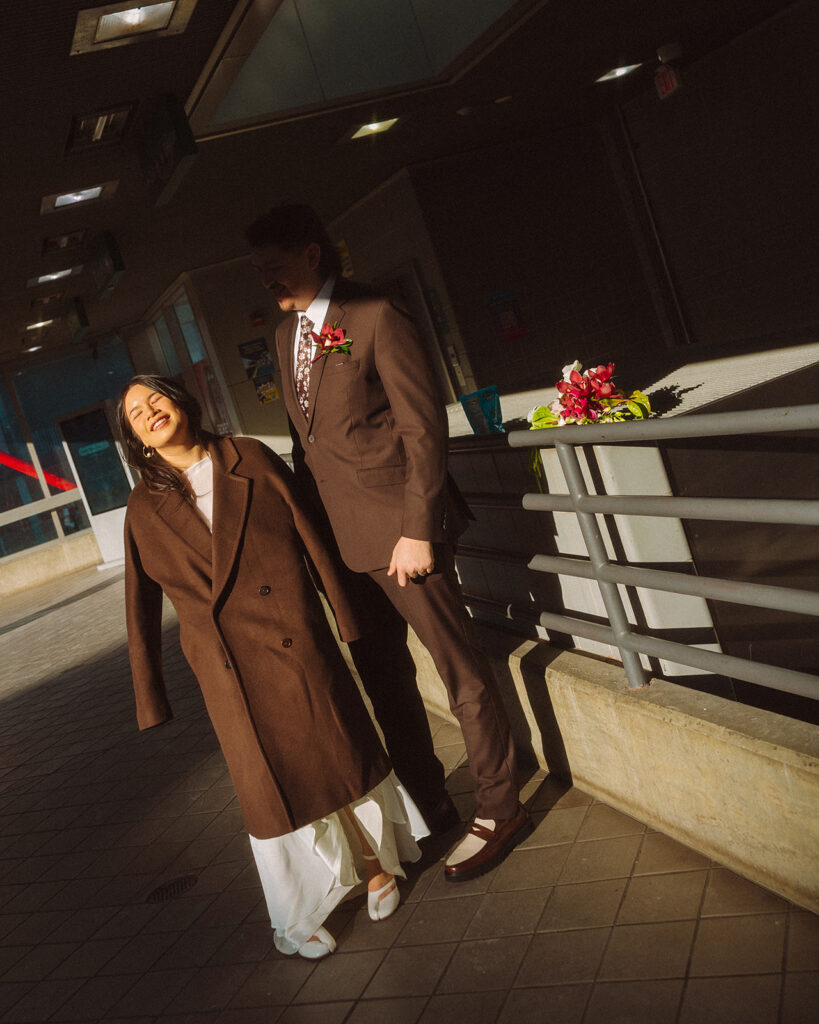 Bride and groom smiling in the golden light.