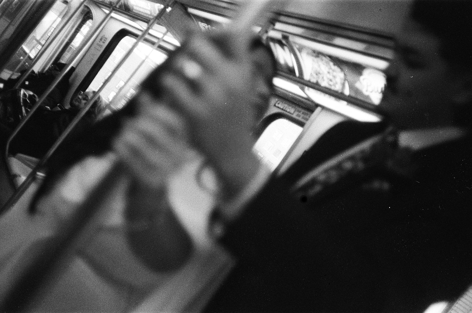 Black and white film photo of a couple riding the People Mover during their Downtown Detroit elopement.