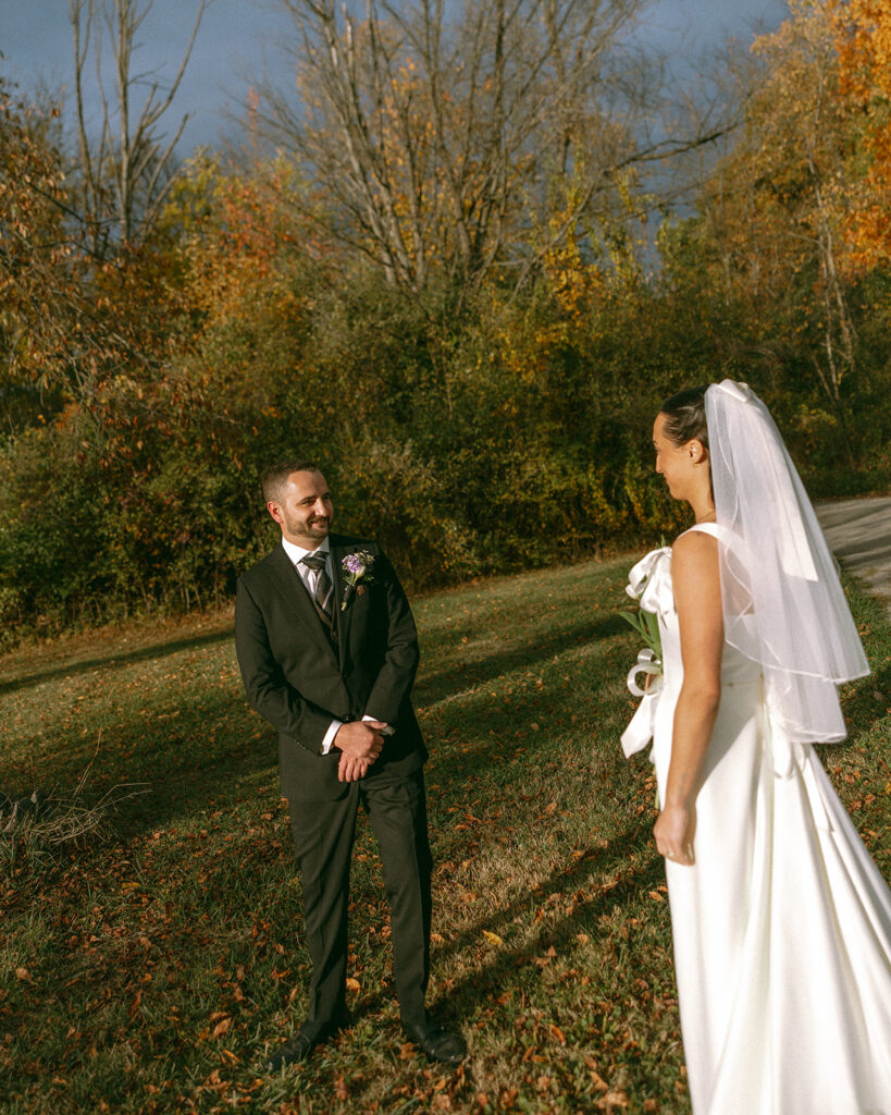 Groom turning around to share a first look with his bride.