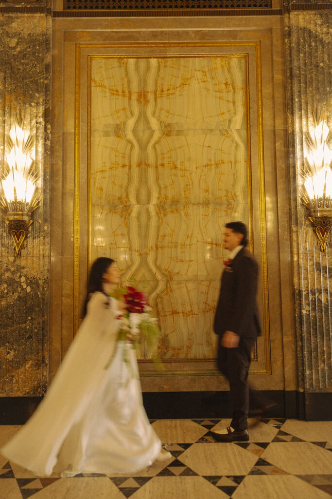 Motion blur photo of a bride and groom at Fisher Building for their Detroit elopement photos.