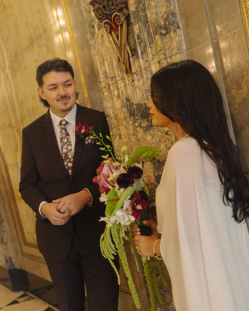 Bride and groom smiling at each other during their Detroit elopement.