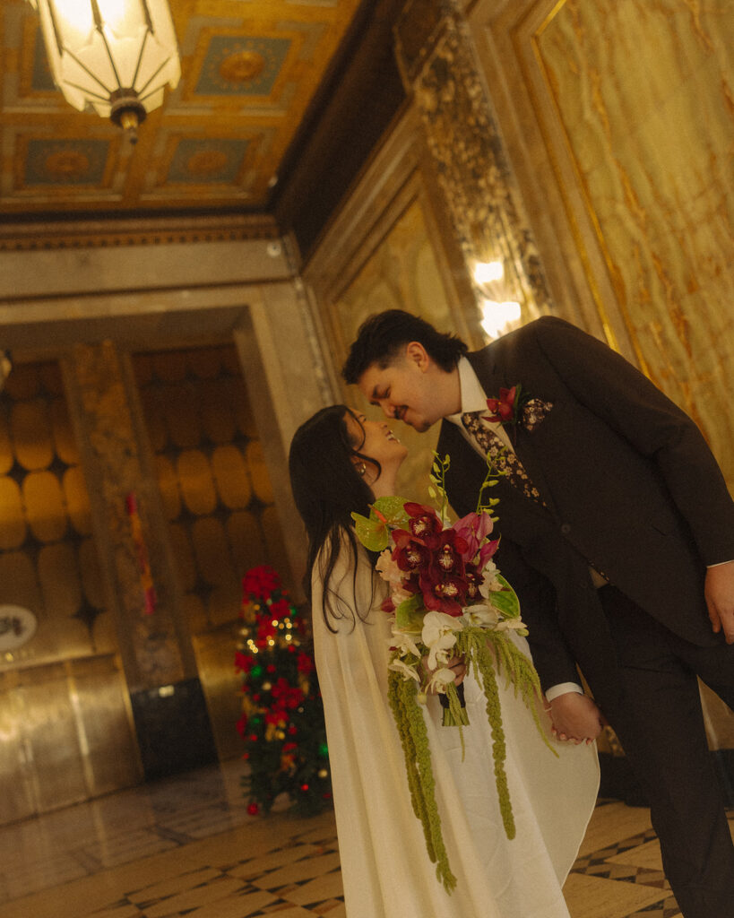 Bride and groom laughing and touching noses during their romantic elopement portraits in Detroit.