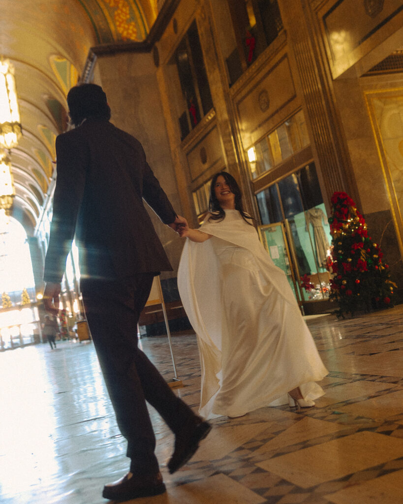 Bride and groom dancing in the lobby at Fisher Building in Detroit.