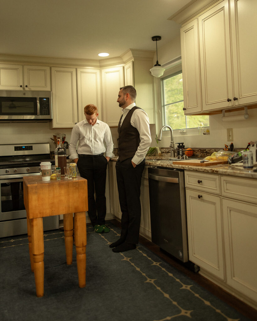 Groom and groomsmen mingling in the kitchen.