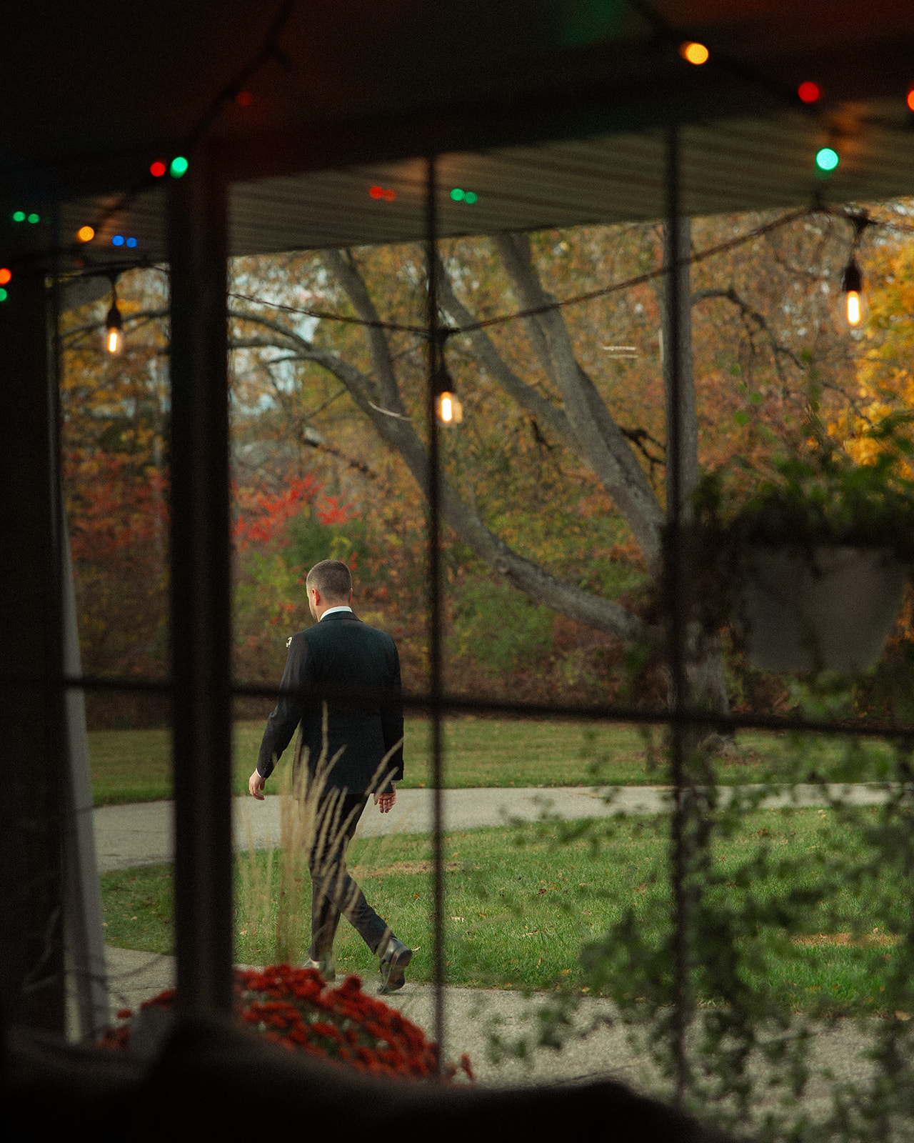 Groom walking outside to wait to share a first look with his bride-to-be.