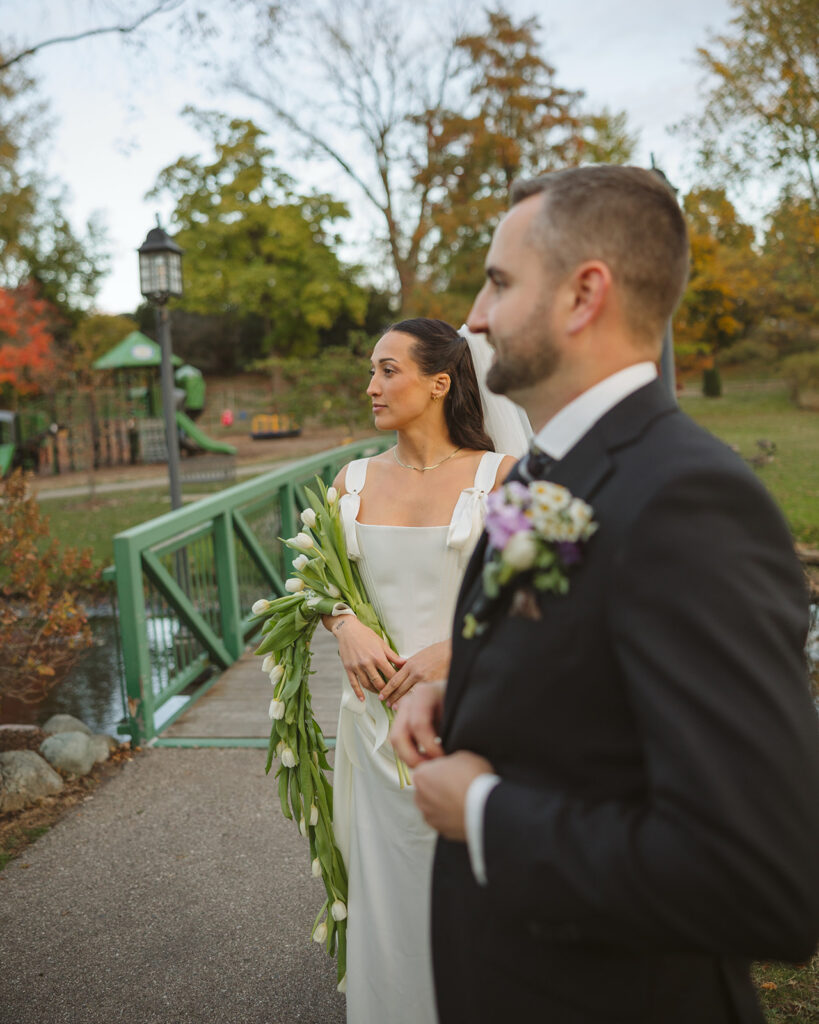 Editorial style wedding portrait of a bride and groom at a park in Clarkston, Michigan.