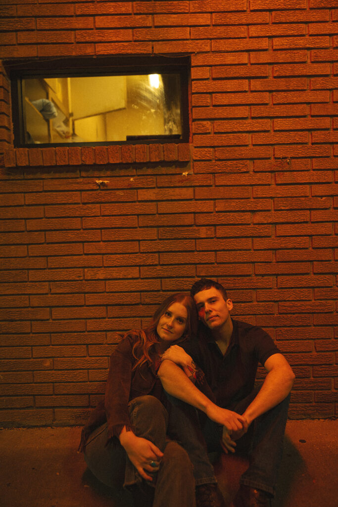 Couple sitting together and looking at the camera.